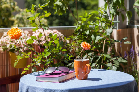 Book, sunglasses and cup of coffeeの写真素材