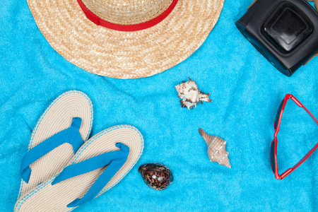 Blue towel with some beach objects
