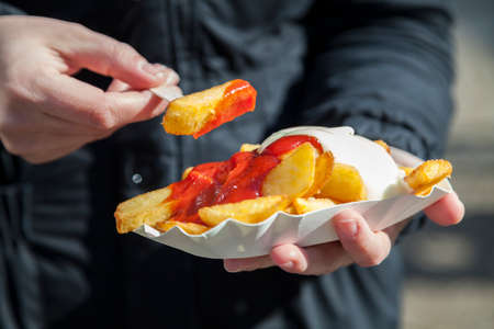 Eating french friesの写真素材