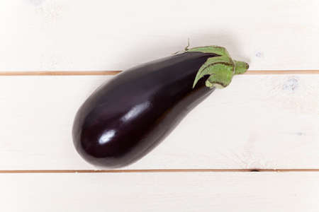 Aubergine on woodの写真素材