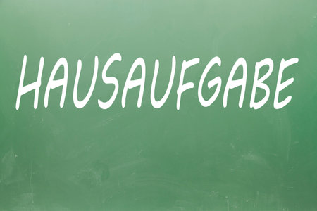Hausaufgabe (homework in german) written on blackboard