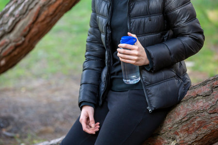 water bottle in woman hand