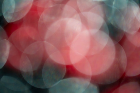 Colorful light bokeh moving on black background
