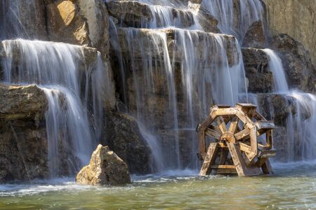 Wooden  watermill on the poolの写真素材