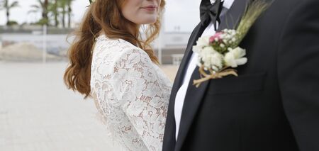 Happy bride and groom. Wedding day on the beachの写真素材