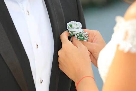 flower boutonniere in a jacketの写真素材