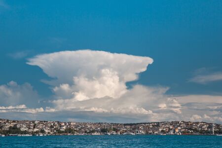 Blue sky background with tiny cloudsの写真素材