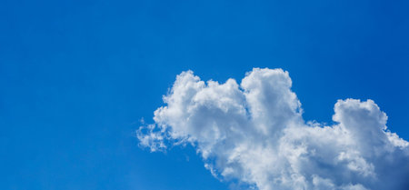 white fluffy clouds in the blue sky