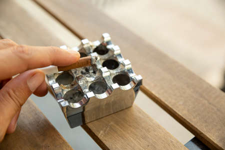 close up cigarette on wooden tableの写真素材