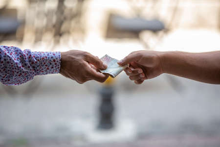 man hand holding money, selective focusの写真素材