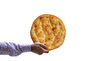 Hand holding Ramadan Pita (Ramadan Pita) on isolated white background