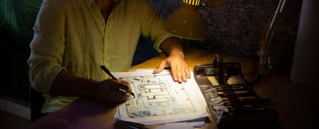 business man drawing a project inside the office. Selective focusの写真素材