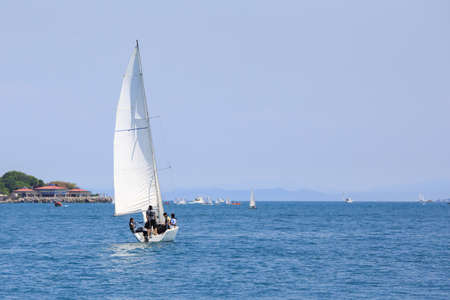 white sailing boat on the sea. Front viewの写真素材