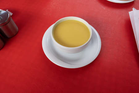 top view Turkish lentil soup on red wooden tableの写真素材