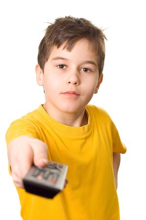 Boy holding a TV remote control in his handの写真素材