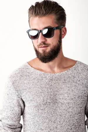 Portrait of an attractive man with a beard and sunglassesの写真素材