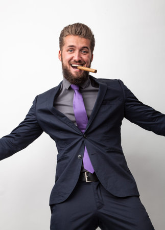 Celebrating business man with cigarの写真素材