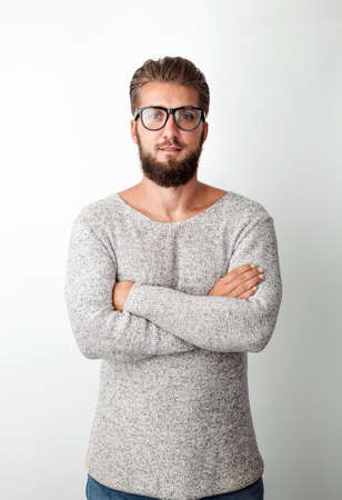Portrait of an attractive man with a beard and glassesの写真素材