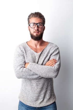 Portrait of an attractive man with a beard and glassesの写真素材