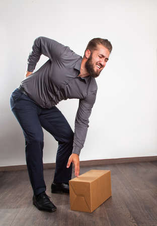 Business man with back painの写真素材
