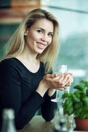 Beautiful woman is drinking green teaの写真素材