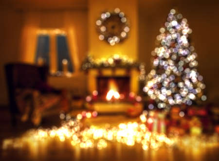 Blurred christmas background with fireplace and christmas treeの写真素材