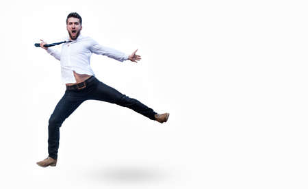 Attractive business man is jumping in the airの写真素材