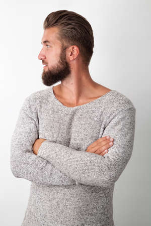Portrait of an attractive man with a beard who crossed his armsの写真素材