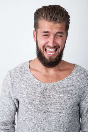Crying man with a beardの写真素材