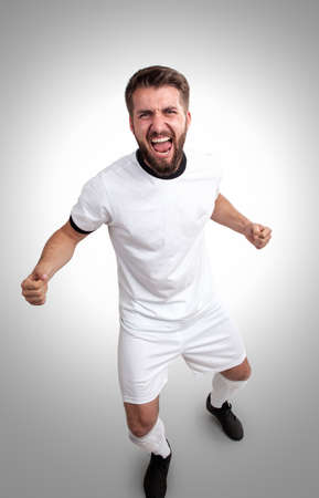 Attractive soccer player is celebratingの写真素材