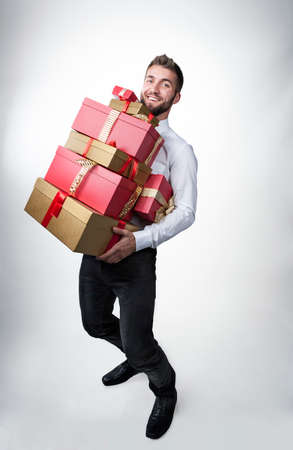 Attractive man with many present boxesの写真素材
