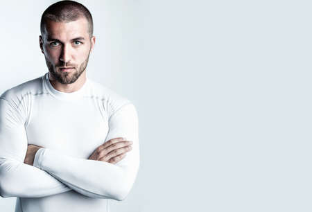 Portrait of an attractive man in sports dressの写真素材