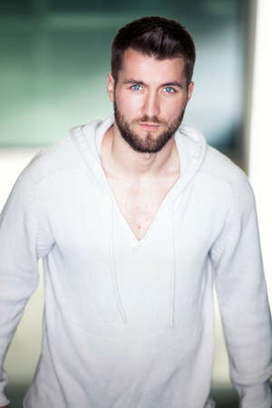 Portrait of an attractive man with a white sweaterの写真素材