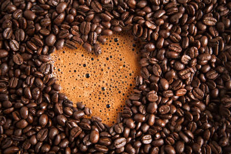 Coffee beans with coffee foamの写真素材