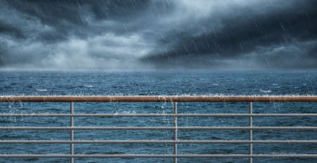 Railing at the sea and much rainの写真素材