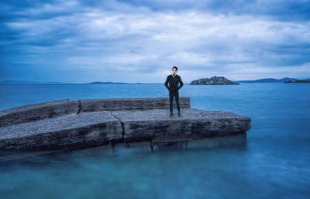 Lonely man is waiting for the ferry boatの写真素材