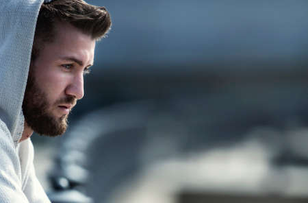 Attractive man with beard is thoughtfulの写真素材