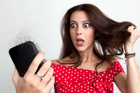 Beautiful young woman with hair loss problemの写真素材