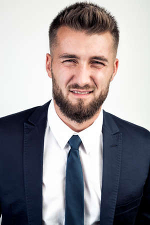 Attractive business man makes a grimaceの写真素材