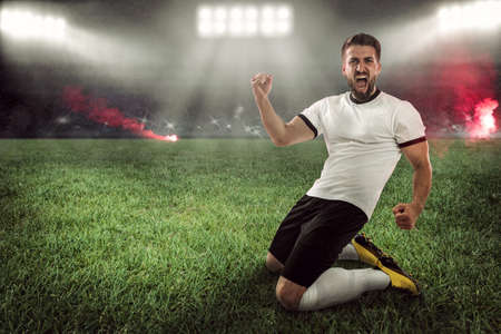 Attractive soccer player is celebrating in the stadiumの写真素材