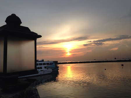 Manila bay. It features the breakwater along Manila bay at dusk sunset.の素材