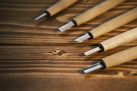 Close up view of a set of wood chisels for carving wood on wooden