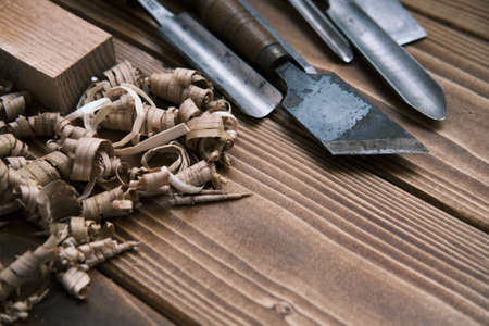 Close up view of a set of wood chisels for carving wood on woodenの写真素材