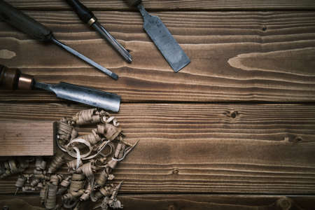 Top view layout of a set of wood chisels for carving wood on woodenの写真素材
