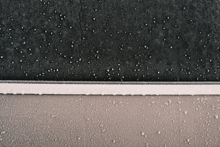 Close up frost on a car window and door in the winter morning. Ready for text
