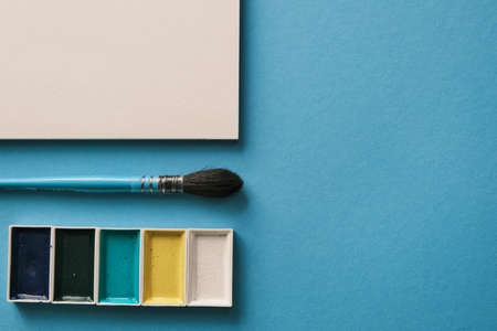 squirrel brush, and watercolor paints in daylight. Artist workspace concept. Text readyの写真素材