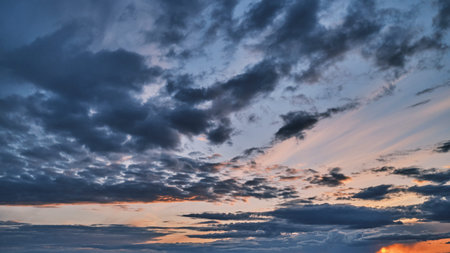 A stormy sky. Colorful image of dramatic cloudscape. Amazing cloud colors before sunset.