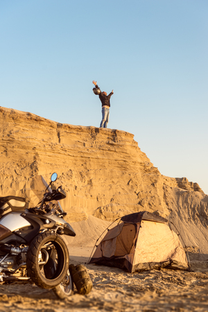 Middle aged motorcyclist won the toughest Dakar adventure. Toned image. Selective focus.の写真素材