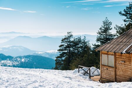Wooden cottage on the top of the mountain with an awesome view.の写真素材