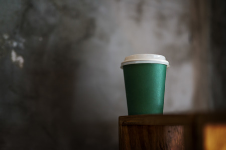 Green coffee to go cup with no branding. Shallow dept of fieldの写真素材